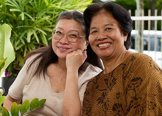 Coreen and Darsiti taking care of plants together