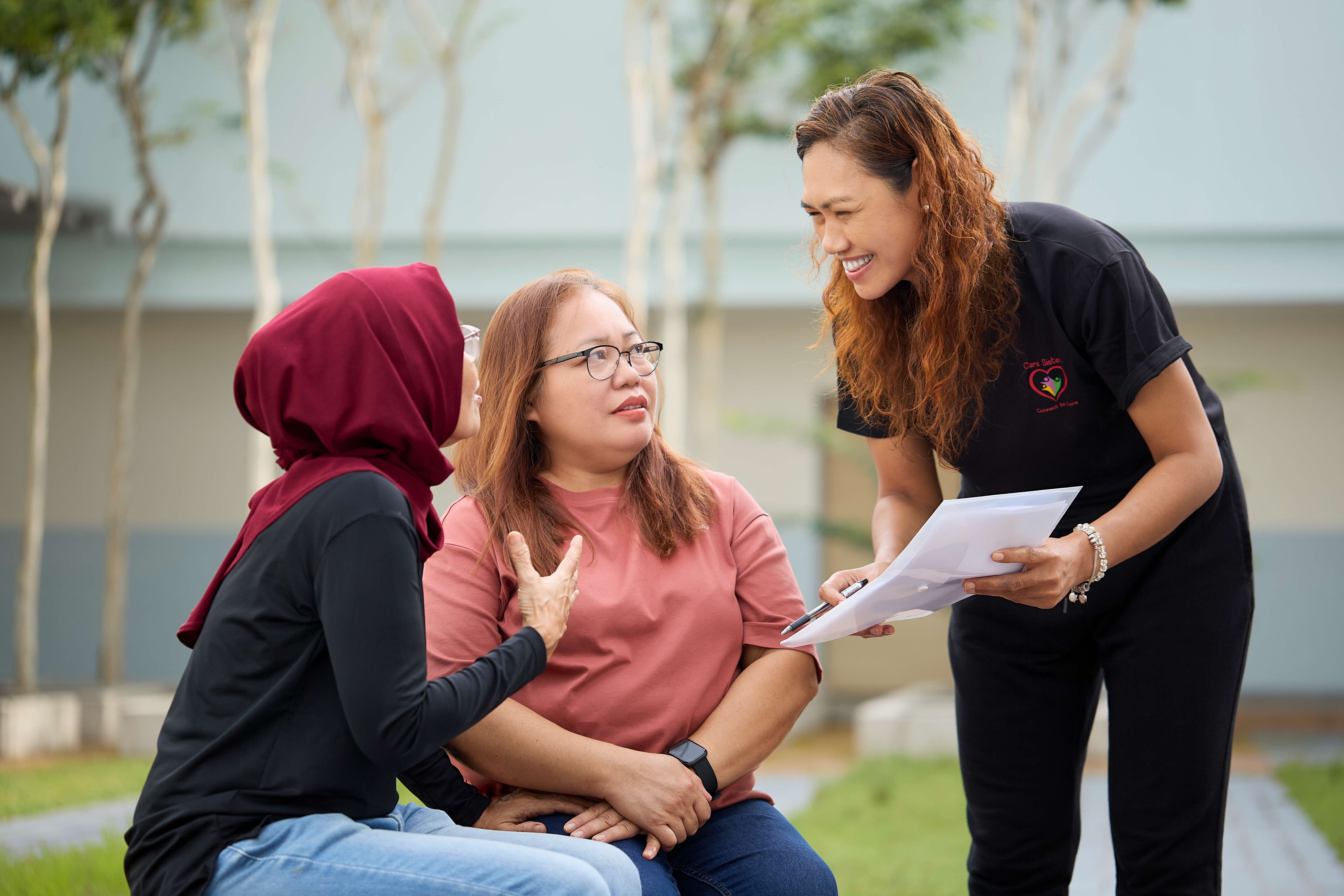 Care Sister speaking to helpers