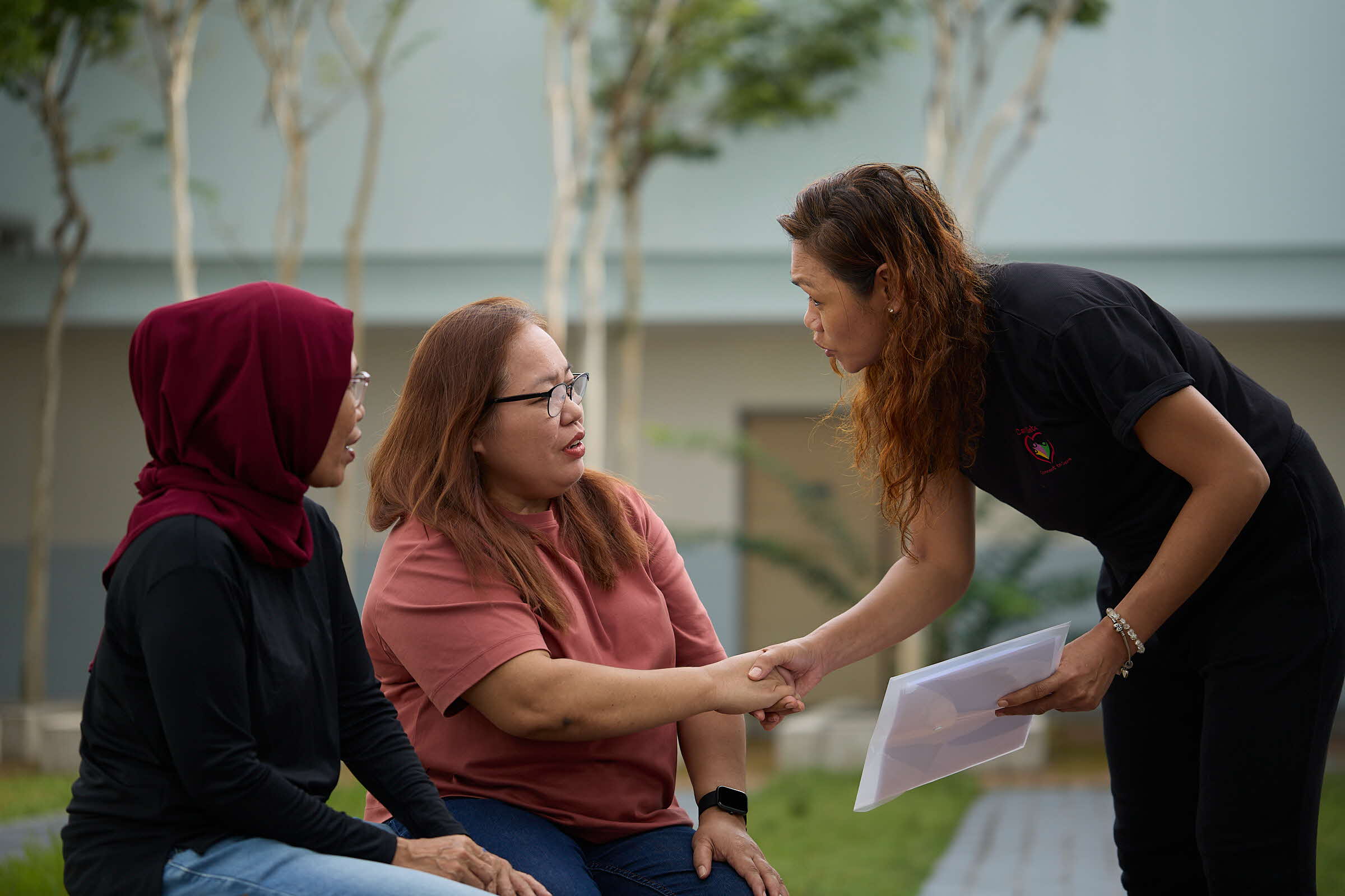 Care Sister reaching out to helpers
