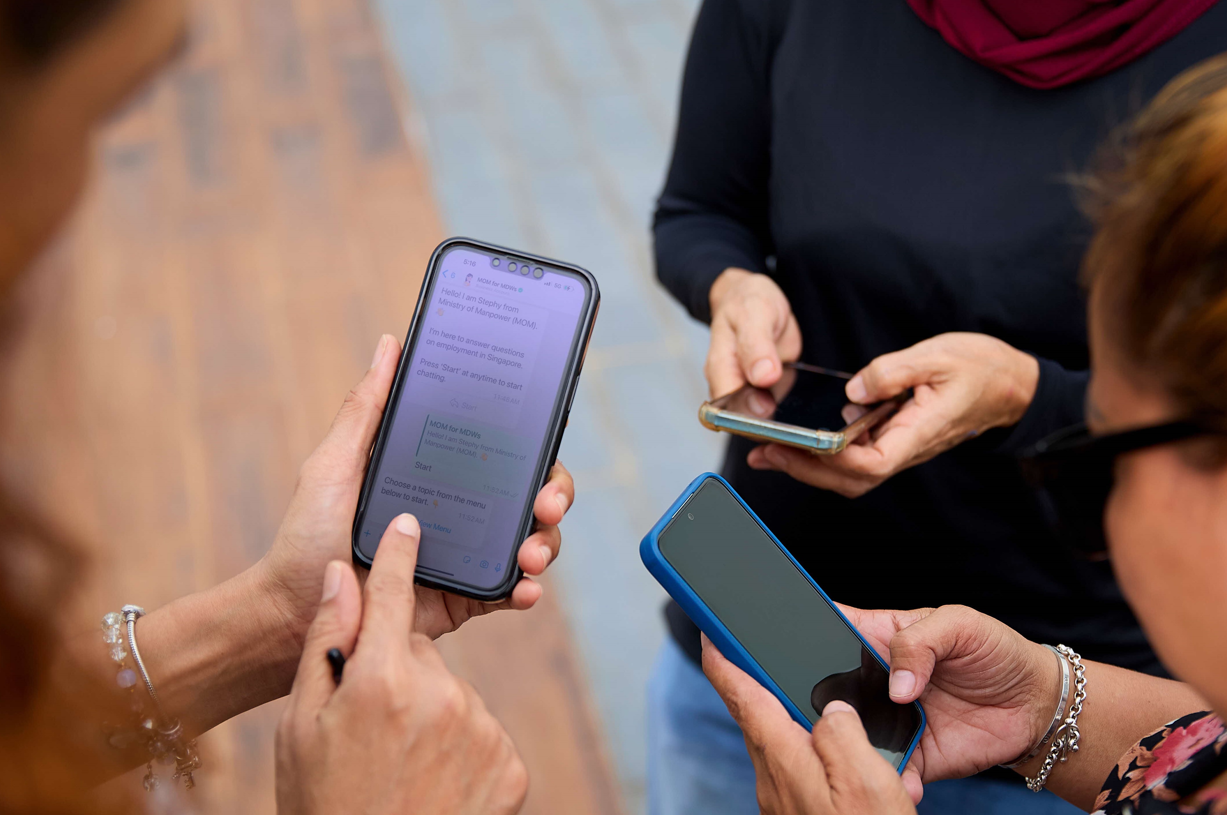 MDWs looking at a phone